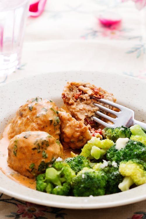 Italian chicken meatballs with cream sauce and broccoli