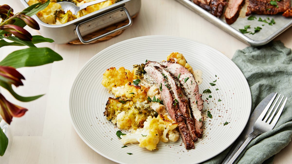 Flank steak with pepper sauce and cauliflower-broccoli gratin