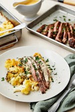 Flank steak with pepper sauce and cauliflower-broccoli gratin