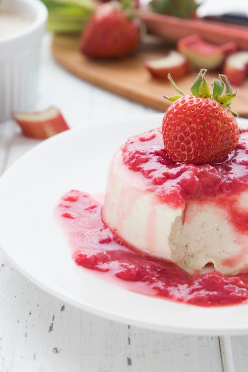 Low carb vanilla panna cotta with strawberry rhubarb sauce