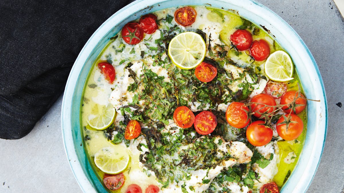 White fish with herbs, coconut milk, lime, and tomatoes