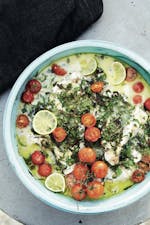 White fish with herbs, coconut milk, lime, and tomatoes
